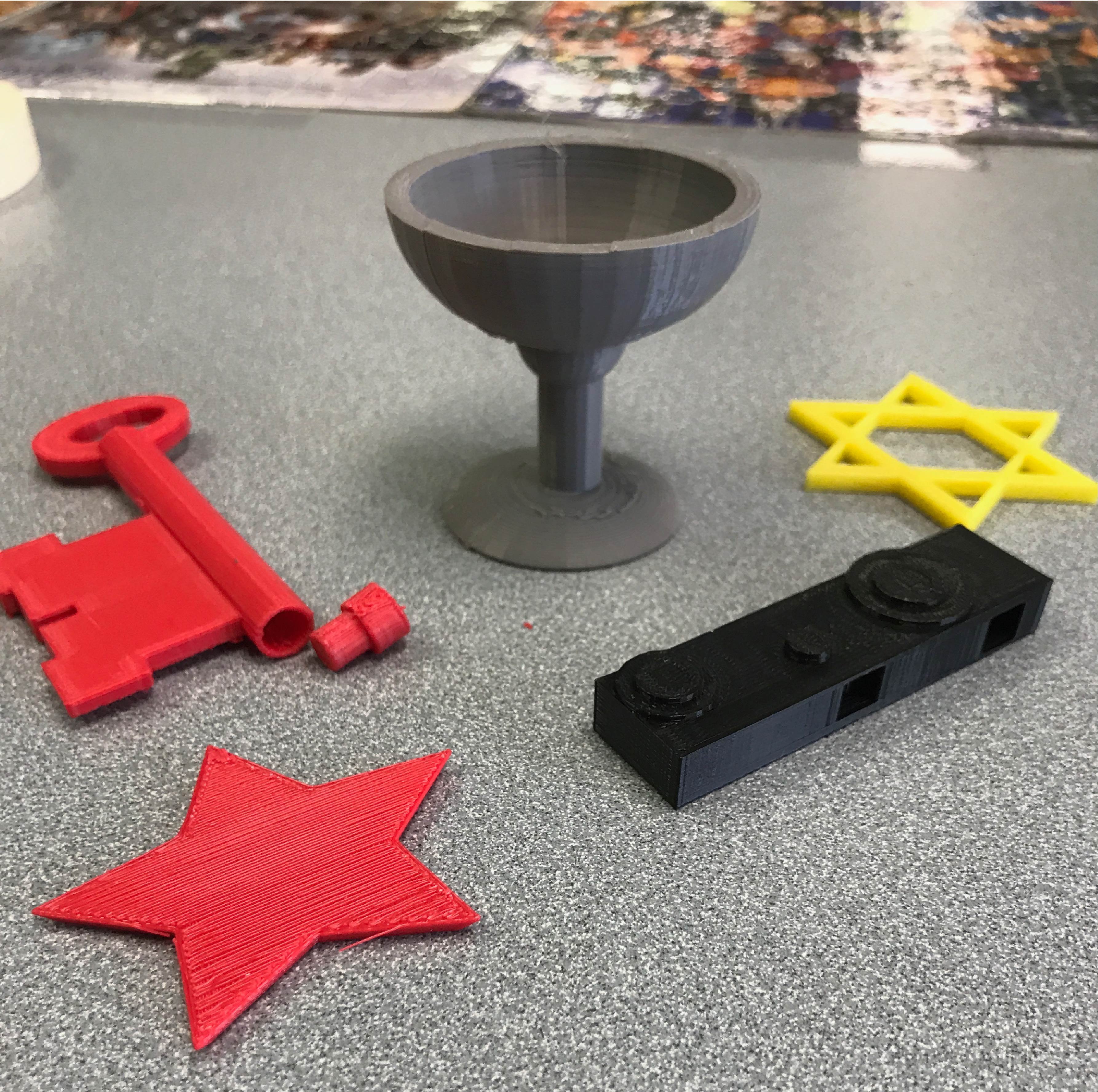 3D printed objects: Chalice, Star of David, hollow spy key, spy camera and star